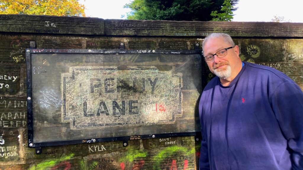 Pete Van Baalen at the Penny Lane sign in Liverpool, England