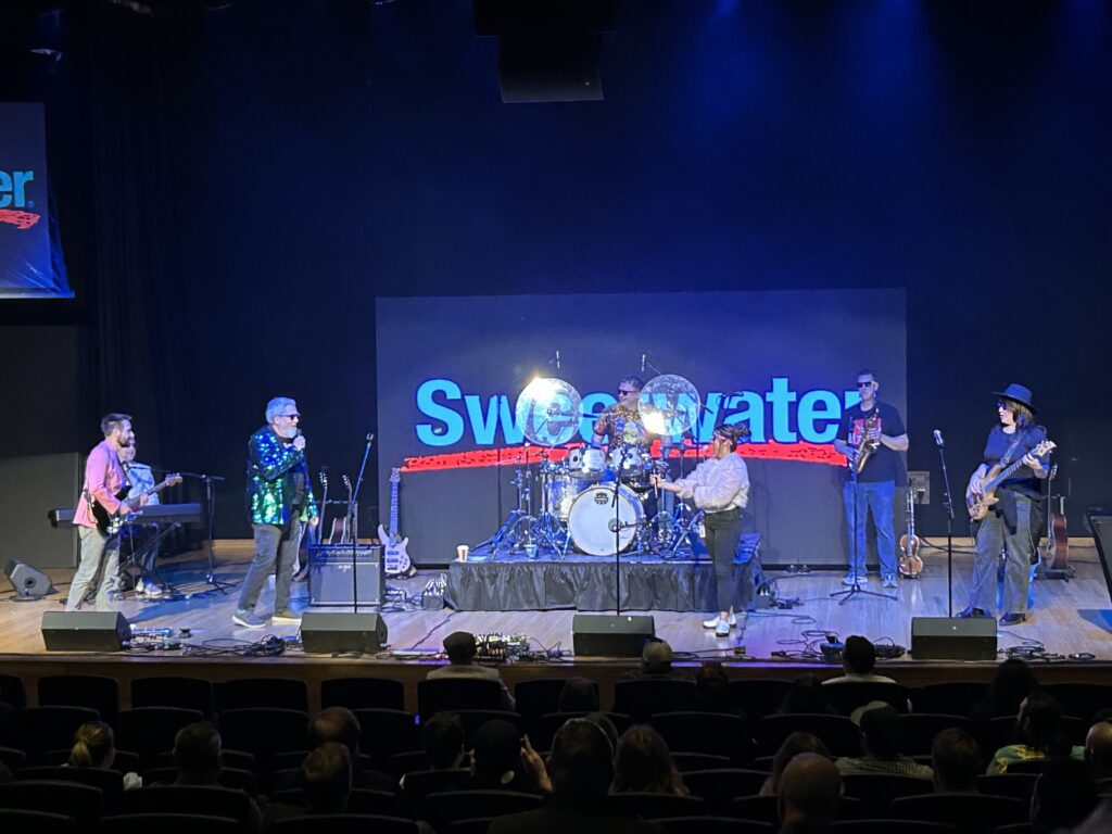 Band on stage singing