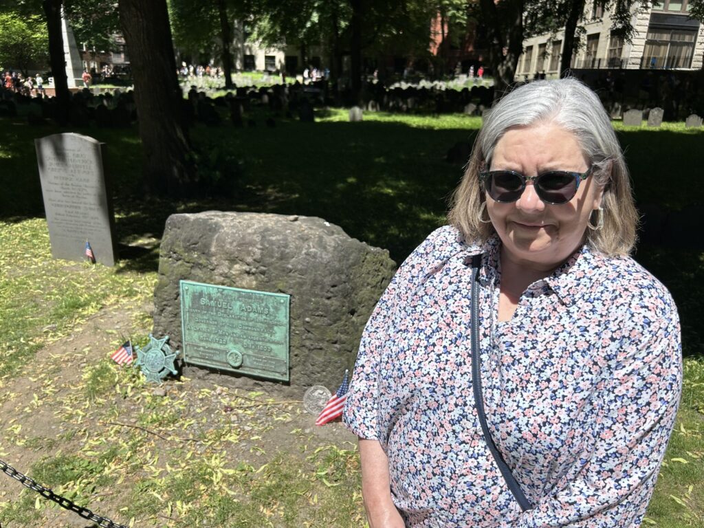 Ruth standing at Samuel Adams' grave in the Granary Burying Ground, Freedom Trail Boston